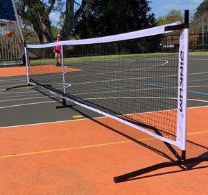 Dinkum® pickleball net. Carry bag with wheels can fit 4 paddles! Premium quality. High tension net fabric. Quick setup.